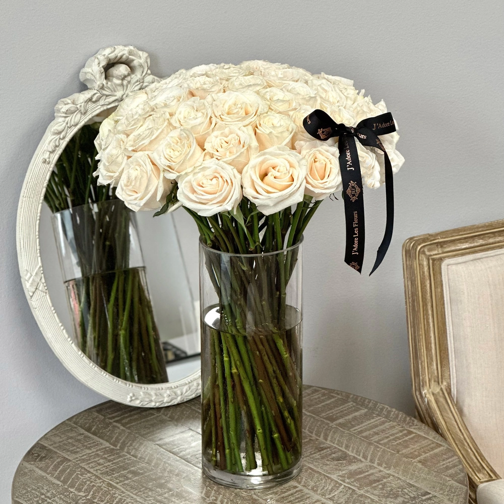 Classic White Stemmed Roses  in a Glass Vase